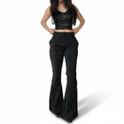Pantalones acampanados a rayas blancas y negras de mujer