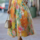 Falda midi con estampado degradado en colores vibrantes