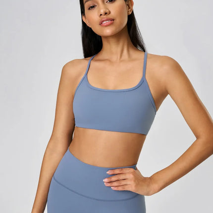 Camisola deportiva con espalda cruzada y escote redondo