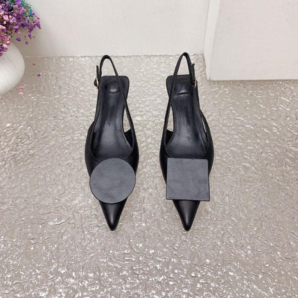 Sandalias Stiletto minimalistas de tacón alto negras de cuero con diseño elegante y cierre de hebilla