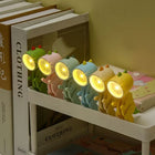 Luz nocturna con diseño de dinosaurio multicolor