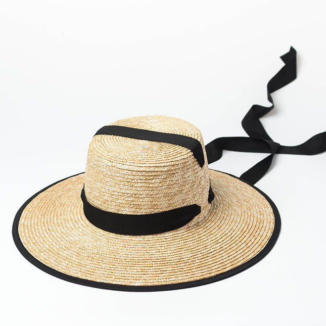 Sombrero de paja para mujer con amplia protección UV y estilo elegante